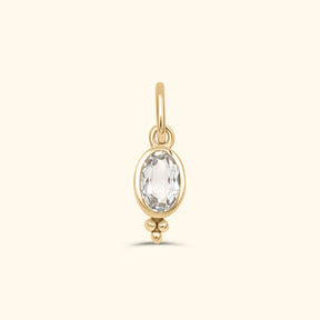 Gold plated birthstone hanger met ovale witte topaas en sierlijk detail – Josephina Jewelry